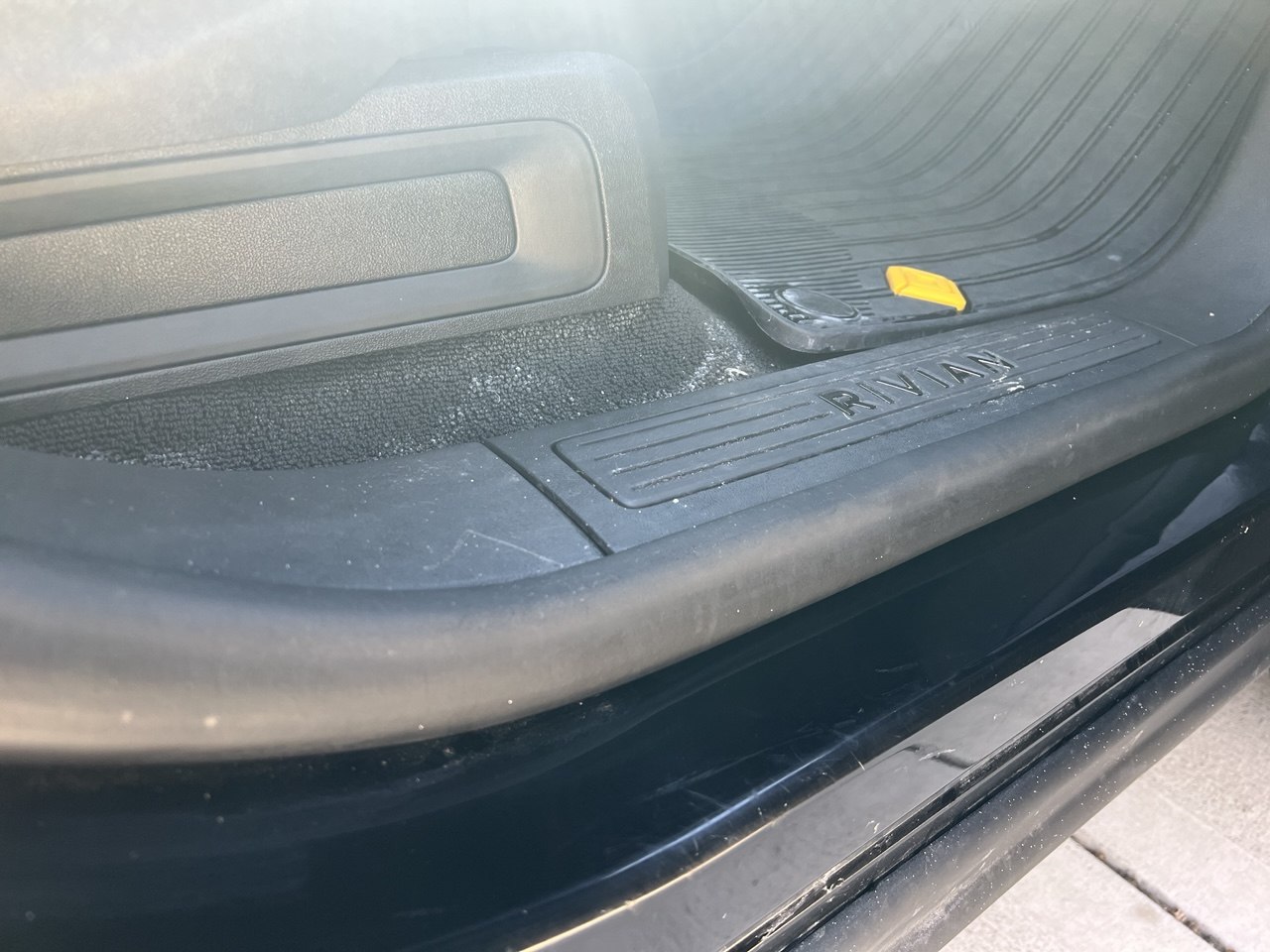 Rivian R1S door sill after touch-up paint applied