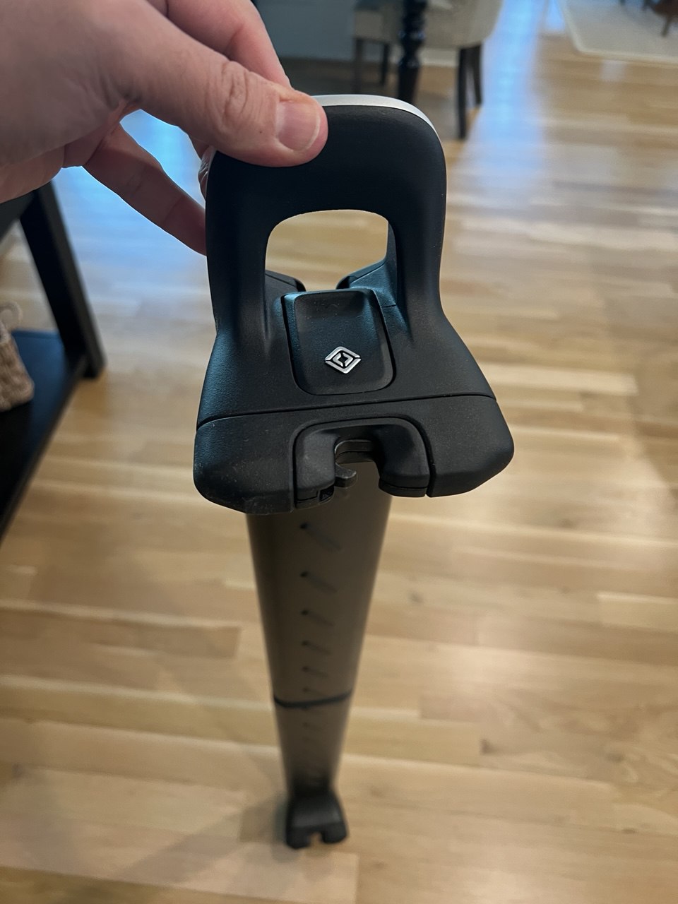 Close-up of Rivian crossbar mount clamp with diamond logo
